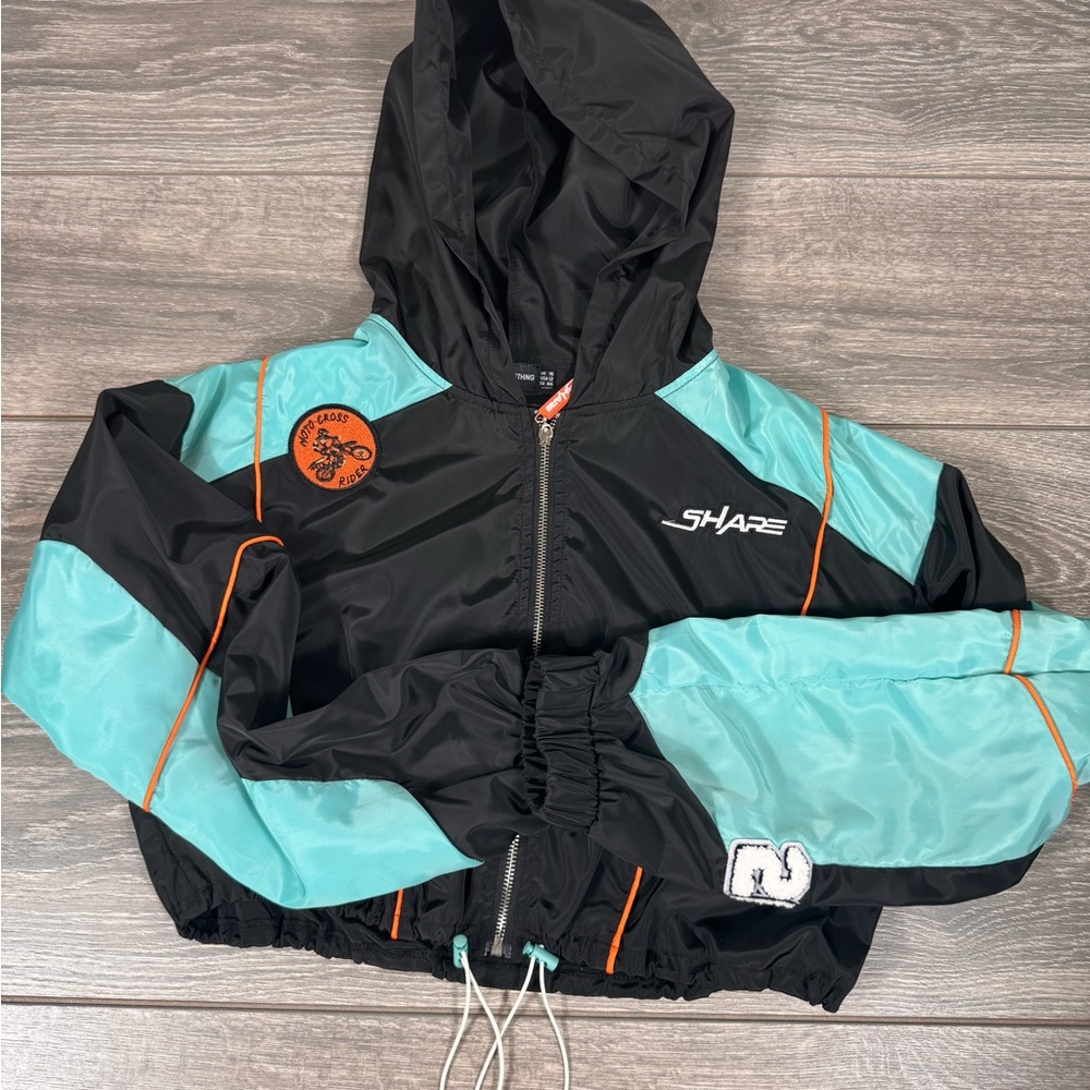 New women’s cropped windbreaker jacket USA size 12.